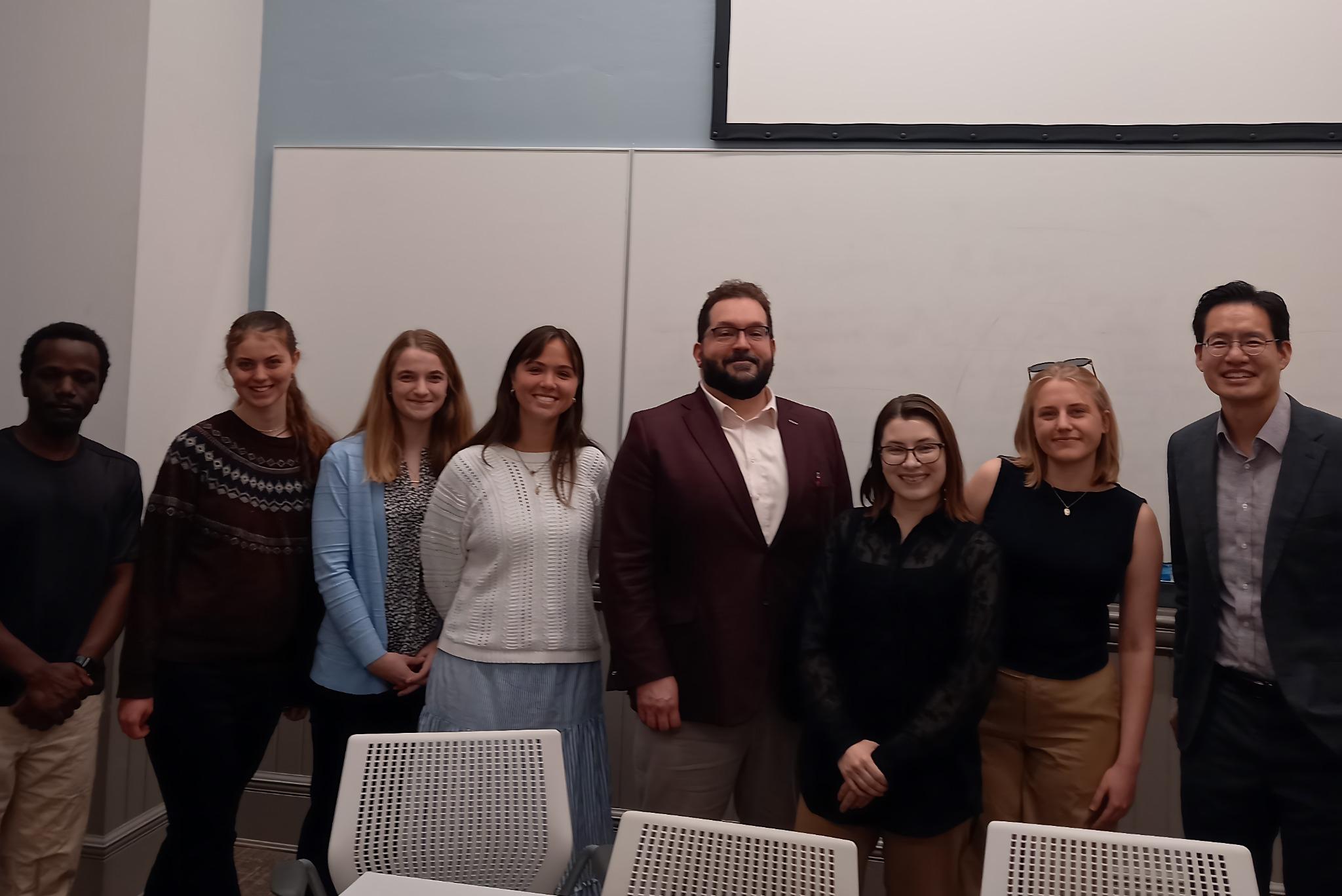 Image of Adam Radman, panelists, and students after CUA Career Panel